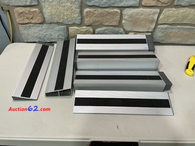 Lot 44-1716b - Aluminum Rise Threshold Ramps for Doorways for wheel chair with non slip black strips E-Commerce Return, A basic inspection has been given t...