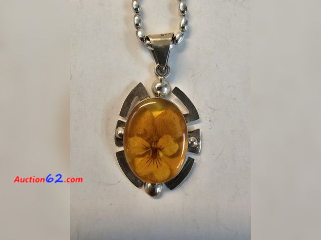 Lot 44-8369w - BIG .925 STERLING SILVER PENDANT WITH HUGE ORANGE STONE THAT HAS A FLOWER INSIDE OF IT. COMES WITH A .925 STERLING SILVER NECKLACE.-T