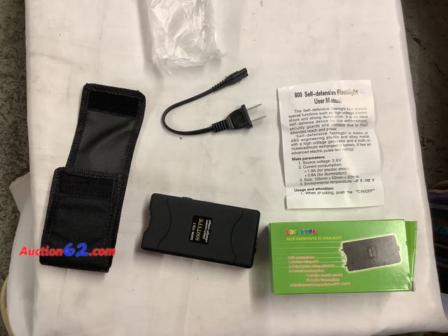 Lot 44-6172a - Type 800 5000k volts stun gun w/ flashlight. Comes with belt case and charger cord. Appears New, A basic inspection has been given to this i...