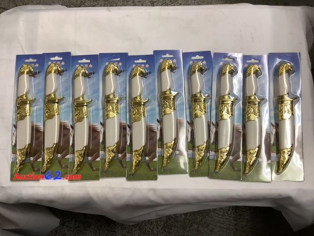 Lot 44-6126q - Lot of 10 toy knives with sheath looks to be sharp. New #93634 See All Photo's Not Tested Never opened, Factory Sealed