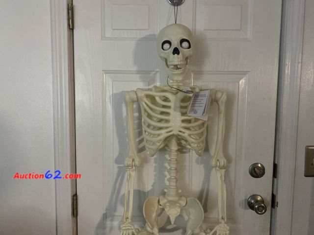 Lot 44-3613m - New approximate 5 foot Pumpkin Hollow LED POSABLE SKELETON.Requires 3 AA batteries, included. Black light responsive. Blinking , light up ey...