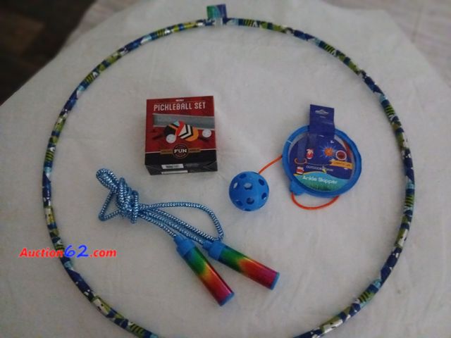 Lot 44-2001a - New Hula hoop.  New Jump rope.  New lights up ankle Skipper.  New in box Mini Pickleball set.  See all photos. Appears New, A basic inspecti...