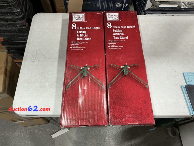 Lot 44-4058f - Lot of (2) 8ft Max Tree Height Folding Artificial Tree Stand Appears New, A basic inspection has been given to this item. Sold AS-IS. See Al...