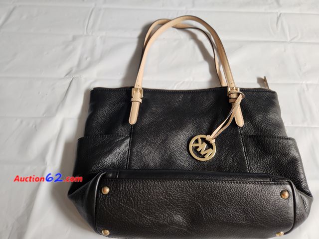 Lot 44-2127g - 1 black with tan straps Michael Kors 16 in. W x 11 in H. purse bought and barely used. No scratches. See photos. Used See All Photo's Added ...