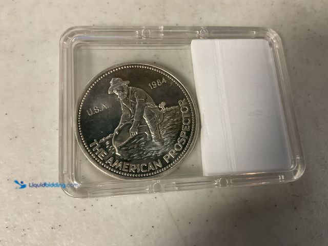Lot 49-1811324 - 1984 ENGELHARD ONE TROY OZ .999 FINE SILVER AMERICAN PROSPECTOR ROUND