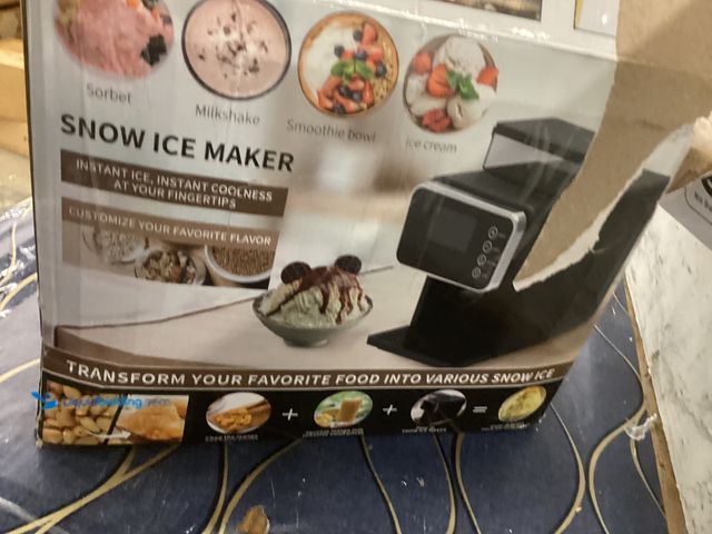 Lot 49-5486984 - Snow Ice Snowcone Maker Model:ZB-2001M Item is used with attachments, powers on, unable to test