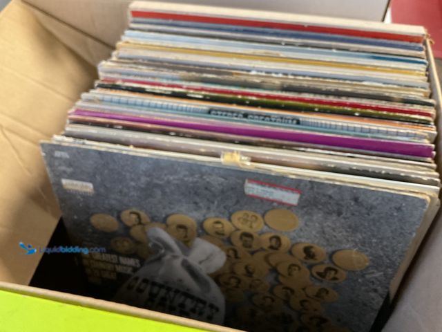 Lot 49-1810299 - COLLECTIBLE BOX FULL OF PRE-OWNED VINYL RECORDS
