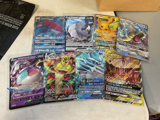 Lot 49-1505295 - COLLECTIBLE LOT OF 8 JUMBO POKEMON CARDS FROM VARIOUS YEARS AND EVOLUTIONS INCLUDING PIKACHU GX, MEO...