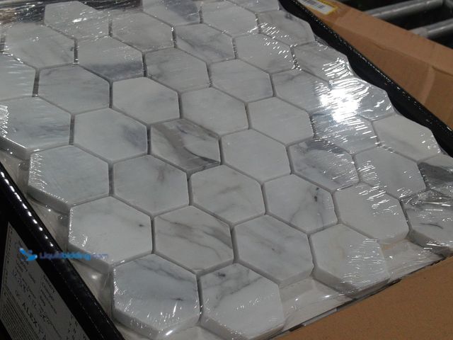 Lot 49-2024916 - Approx. (9) Sq. Ft. of  MSI Calacatta Cressa 12.38 x 12.38 in. Honed Hexagon Mosaic Tile with Distin...