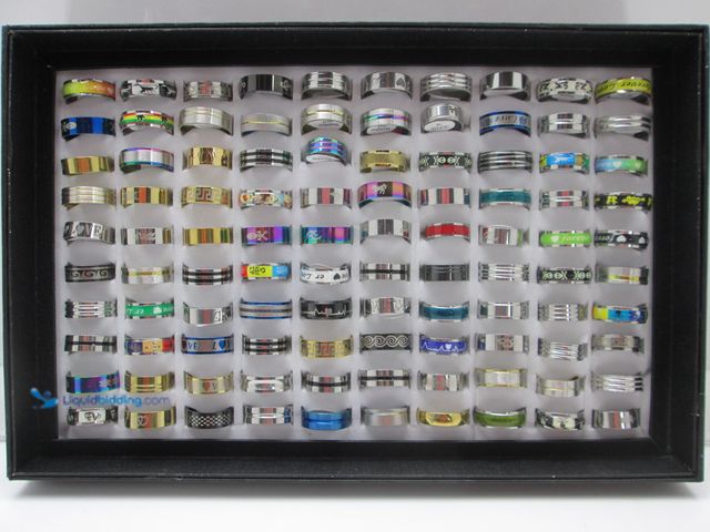 Lot 49-1616267 - Bulk Lot of 100 Stainless Steel Rings in Retail Display Box - NEW - Includes Men's and Women's Sizes...
