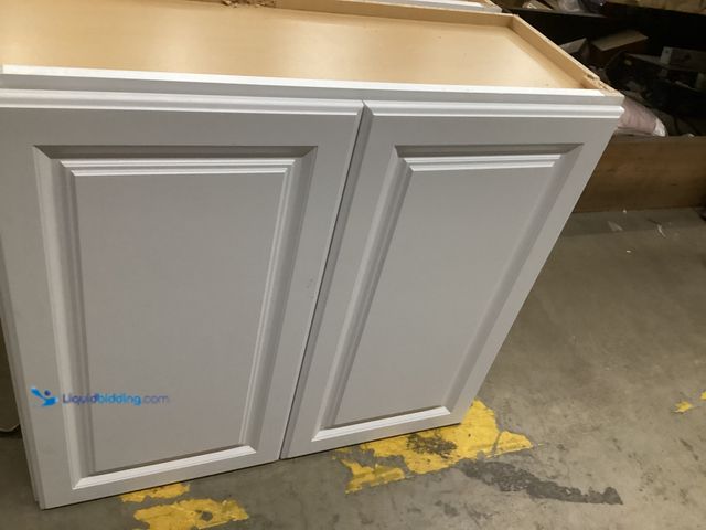 Lot 49-5555532 - Hampton Bay Assembly Wall Kitchen Cabinet in Satin White, Unused with hardware,  chipped on frame wi...