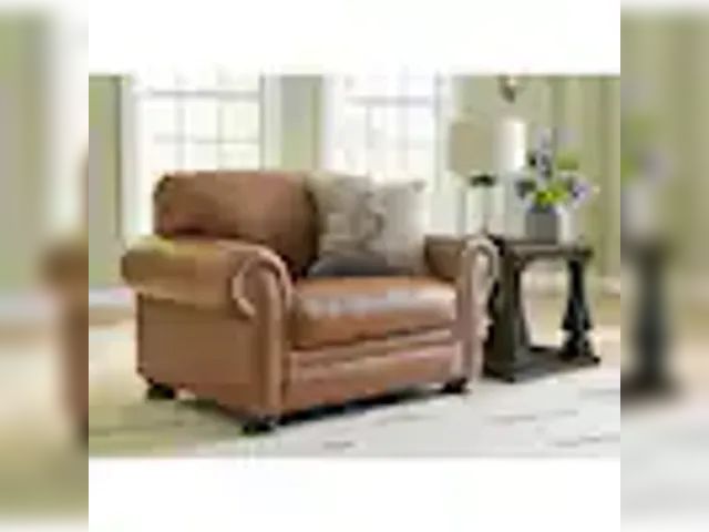 Lot 49-1589289 - Signature DESIGN BY ASHLEY Carianna Brown Leather Match Chair and a Half with Removable Cushions and...