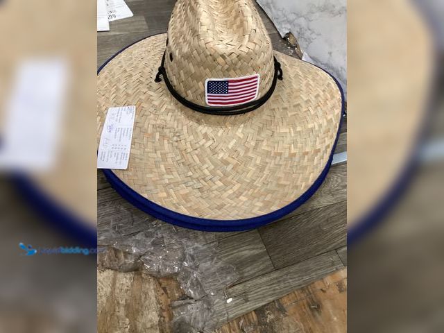 Lot 49-5436883 - Qty 2. Straw hat with American flag on fron and on the underside. Unused.