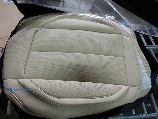Lot 49-1542655 - 2 Front Seat Cover, Beige Leather, Slightly used, Zipper on Bag is Broke.  Ref#BLUEAMA1020