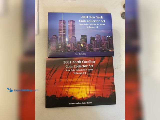 Lot 49-5515676 - LOT OF 2 STAE QUARTER COIN COLLECTOR SETS INCLUDING 2001 NEW YORK AND 2001 NORTH CAROLINA COINS COME...