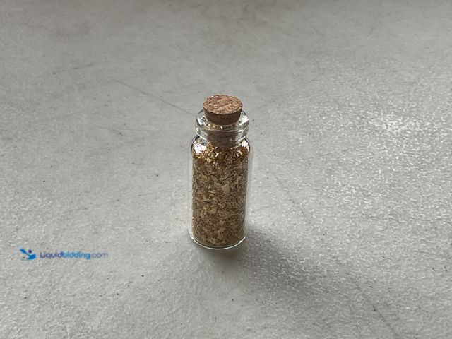 Lot 49-1977469 - RARE ONE INCH GLASS VILE OF PURE 24K GOLD FLAKES