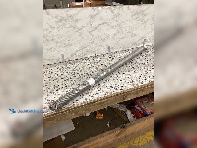 Lot 49-5460361 - Torsion Spring for EZ Set, Lt Wind (Ref. White B) Item is used.