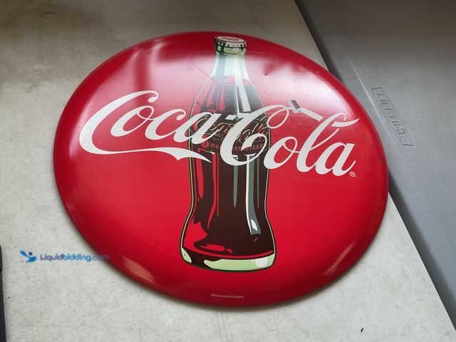 Lot 49-2009008 - Other NEW METAL COLLECTOR BUTTON SIGN “COCA-COLA” MEASURES APPROXIMATELY 14 INCH DIAMETER