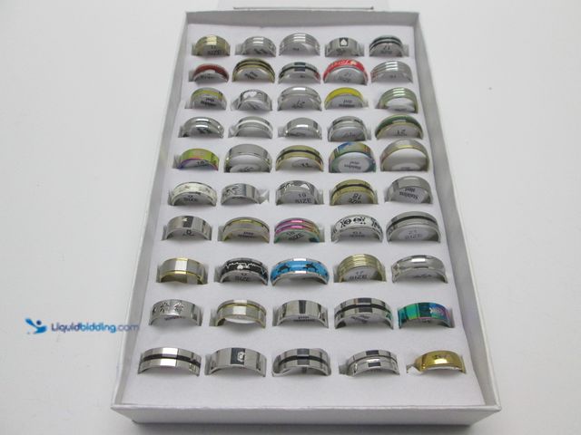 Lot 49-1811680 - Bulk Lot of 50 Stainless Steel Rings in Retail Display Box - NEW - Includes Men's and Women's Sizes/...