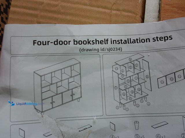 Lot 49-3481675 - 11 Cube Four Door Bookshelf With Legs, Natural/White, Unused, Some Pieces are Slightly cracked and c...