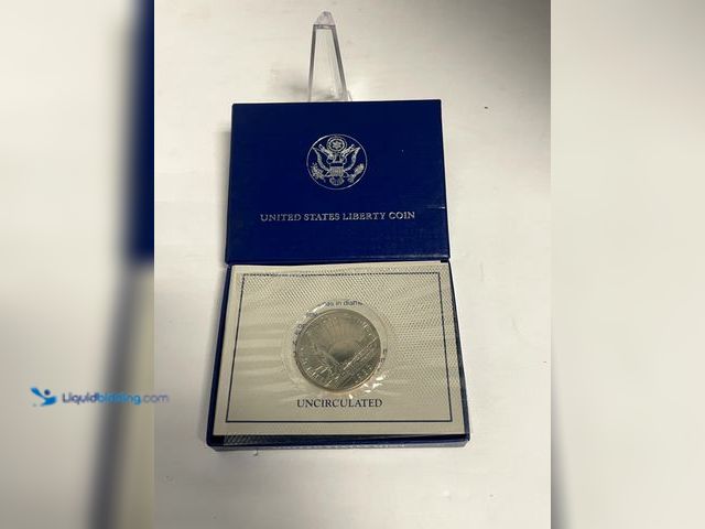 Lot 49-910560 - Official 1975 Bicentennial Medal commemorating the Battles of Lexington and Concord, featuring a pro...