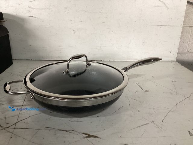 Lot 49-3617648 - HexClad 8-Pc Cookware Set with (4) Pans and (4) Lids - slightly used condition, has attachments   Re...