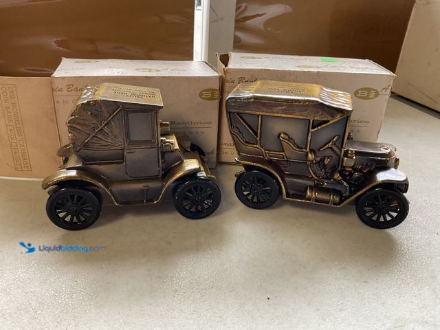 Lot 49-1505223 - COLLECTIBLE LOT OF 2 VINTAGE BANTHRICO PRESSED METAL BRONZE COIN BANKS IN ORIGINAL BOXES BOTH FROM V...
