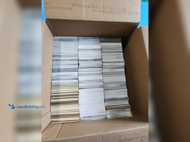 Lot 49-1817788 - BOX OF AROUND 2,000 COLLECTIBLE SPORTS CARDS. VARIOUS SPORTS BRANDS AND YEARS PRODUCED. NOTICED MANY...