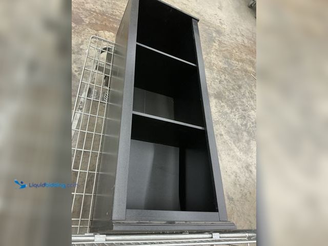 Lot 49-5547979 - Black shelf with Shelf attachments included. Unused, dusty