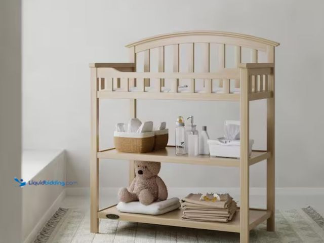 Lot 49-2001110 - Graco Driftwood Changing Table, Made of high-quality pine wood and composites for durability, Water-...