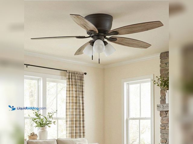 Lot 49-1637982 - Sidlow 52 in. Indoor LED Bronze Hugger Dry Rated Ceiling Fan with 5 QuickInstall Reversible Blades a...