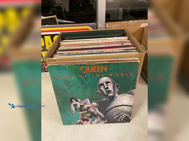 Lot 49-1505458 - COLLECTIBLE LARGE BOX FULL OF PRE-OWNED VINYL RECORDS FROM VARIOUS YEARS AND GENRES INCLUDING QUEEN,...