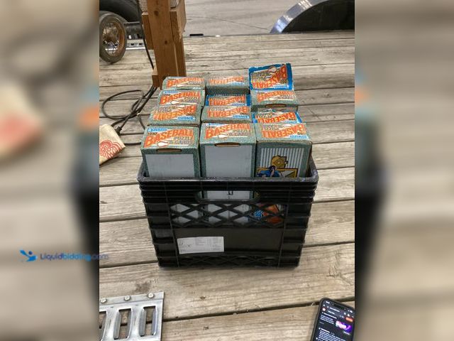 Lot 49-5496023 - 12 boxes of baseball cards NOT SEALED, some of the packs in the boxes are sealed, but not all.