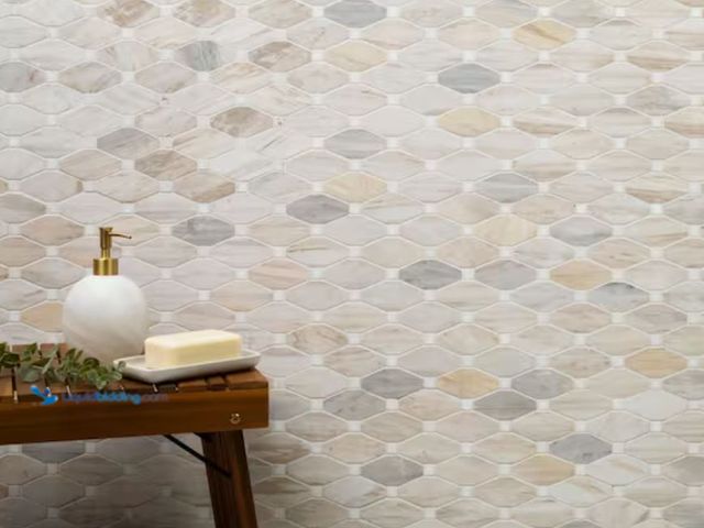 Lot 49-1631132 - APPROX. (7) SQ FT of MSI Angora Elongated Octagon 12 in. x 13 in. x 0.38 in. Polished Marble Mesh-Mo...