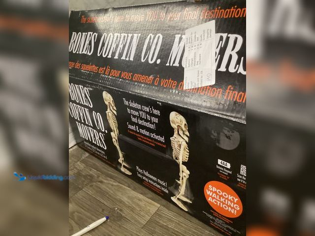 Lot 49-5436804 - Animatronics Bones Coffin Co Movers sound & motion activated walks & plays music. Unused.
