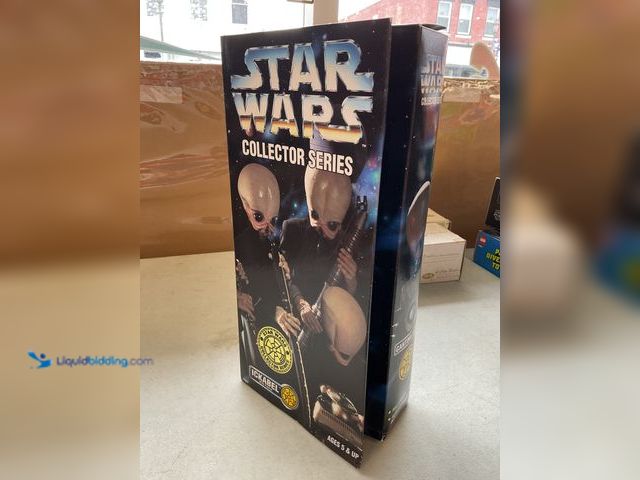 Lot 49-1505215 - COLLECTIBLE 1997 STAR WARS ICKABEL WITH FANFAR CANTINA BAND 12 INCH ACTION FIGURE IN ORIGINAL BOX #C...