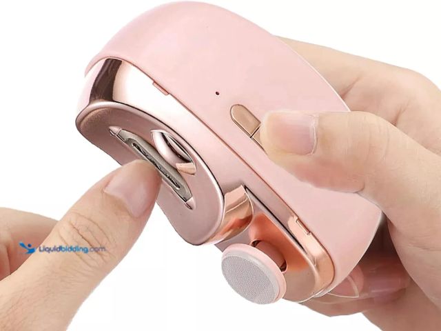 Lot 49-1820421 - 2-In-1 Automatic Nail Trimming/Polisher Pink - NEW - Designed for trimming and polishing nails, with...