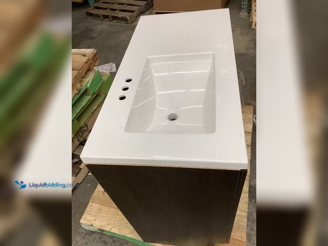 Lot 49-5414750 - marble white black cabinet bathroom vanity sink. Unused, mssing 2 handles, top cracked by sink, scuf...