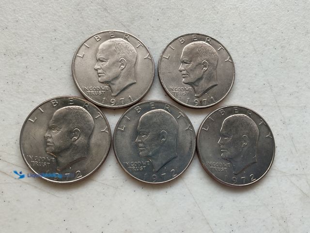 Lot 49-1804527 - 5 “IKE” EISENHOWER LARGE ONE DOLLAR COINS.