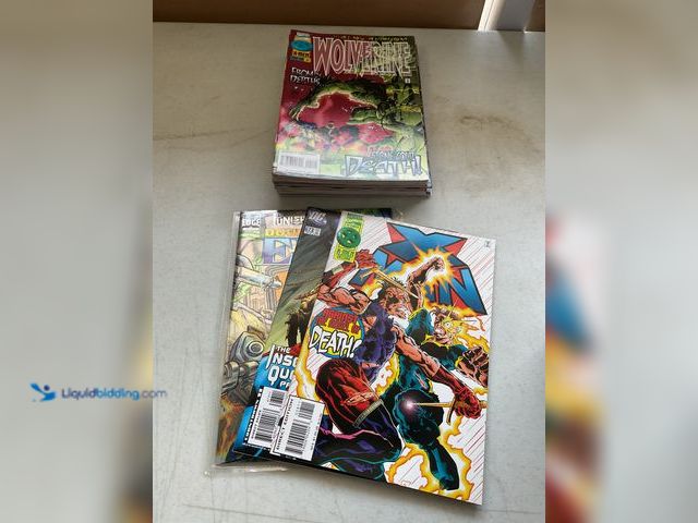 Lot 49-3503984 - LOT OF 20 COLLECTIBLE COMIC BOOKS FROM DC, MARVEL AND MORE INCLUDING PUNISHER, SUPERMAN, XMAN, WOLVE...