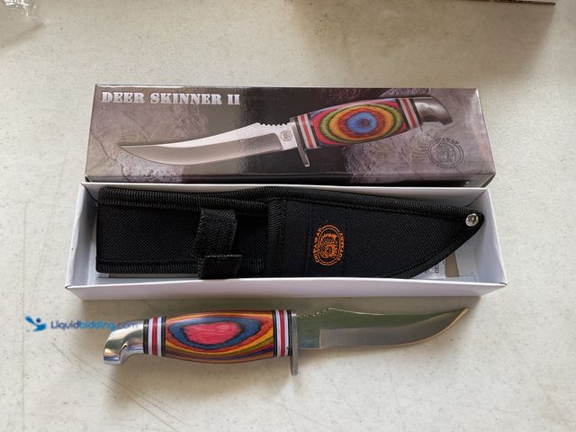 Lot 49-3503979 - NEW IN ORIGINAL BOX DEER SKINNER II KNIFE CW-541FW BLADE MEASURES 4.5 INCHES WITH CANVAS HOLDER