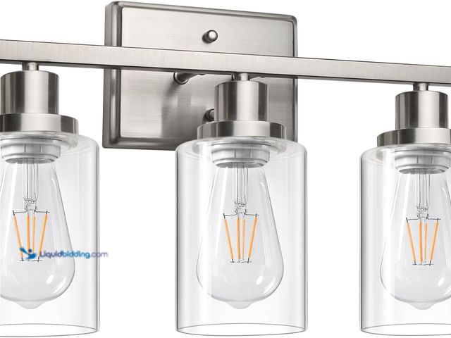 Lot 49-5453115 - Ascher Bathroom Vanity Light Fixtures, 3 Light Wall Sconces Lighting with Clear Glass Shade, Brushed...