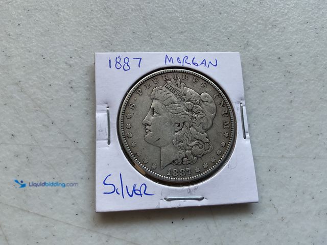 Lot 49-1804648 - 1887 MORGAN ONE DOLLAR COIN