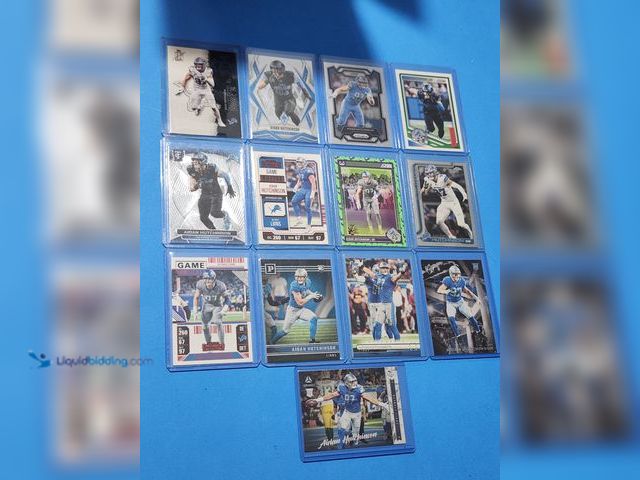 Lot 49-1817840 - 13- COLLECTIBLE AIDAN HUTCHINSON NFL FOOTBALL CARDS. INCLUDES ROOKIES INSERTS AND BASE CARDS. ALL CA...