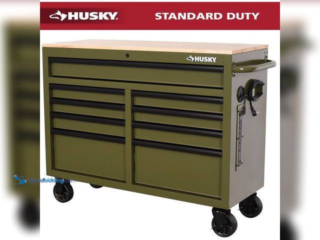 Lot 49-5446742 - Husky
46 in. W x 18.1 in. D 9-Drawer Army Green Mobile Workbench Cabinet with Solid Wood Top. SKU #...