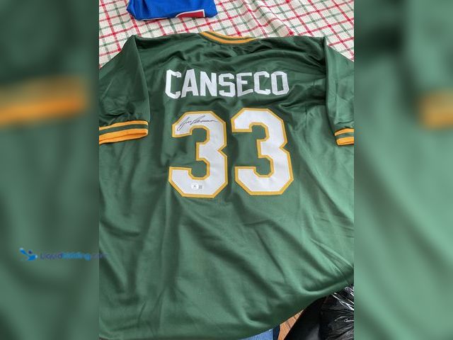 Lot 49-1505912 - COLLECTIBLE VERY NICE OAKLAND A’S JOSE CANSECO AUTOGRAPHED STITCHED BASEBALL JERSEY WITH BECKETT WIT...