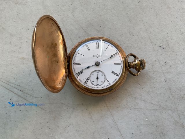 Lot 49-1830553 - COLLECTIBLE VINTAGE ILLINOIS BRAND GOLD IN COLOR CASED POCKET WATCH NOT WORKING BUT LOOKS TO BE COMP...