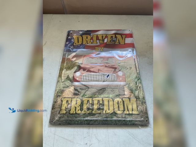 Lot 49-5451681 - Other BRAND NEW METAL COLLECTOR SIGN “DRIVEN BY FREEDOM” MEASURES APPROXIMATELY 12 INCH BY 16 INCH