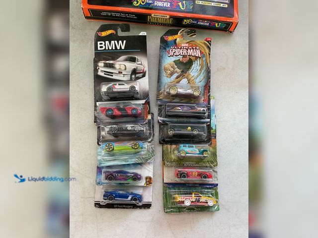 Lot 49-1505510 - Other LOT OF 12 HOT WHEELS 1/64 SCALE DIECAST CARS IN ORIGINAL PACKAGES VARIOUS MAKES AND MODELS #CO...