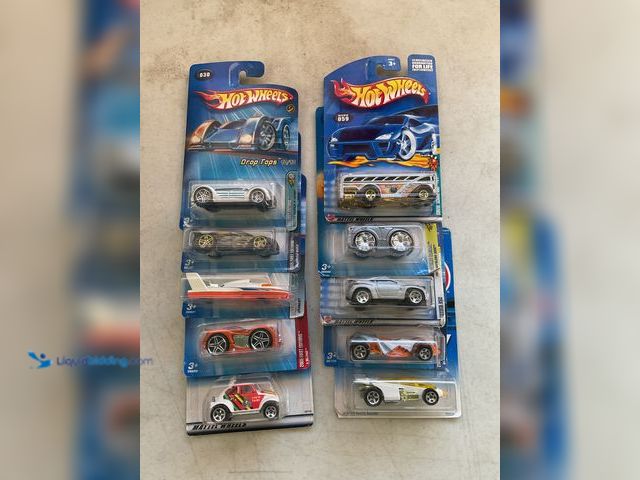 Lot 49-1505055 - COLLECTIBLE LOT OF 10 HOT WHEELS 1/64 SCALE DIECAST CARS IN ORIGINAL PACKAGES VARIOUS MAKES AND MODE...